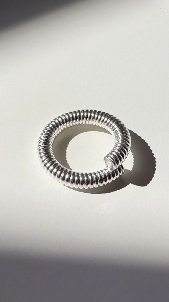 The Spring Ring, cast in solid 925 sterling silver. Designed in our studio in Lisbon, handmade in Portugal.